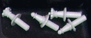 Close up of chess pieces lying inside one of the two �NOVAG PICCOLO�  storage compartments for chess pieces.